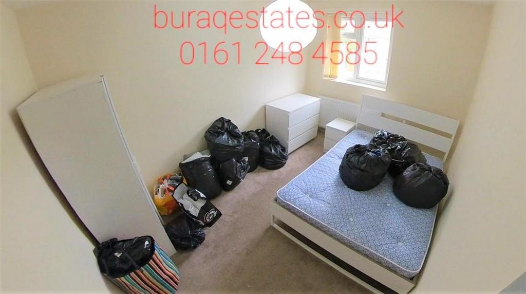 Small, simply furnished bedroom with a single b...