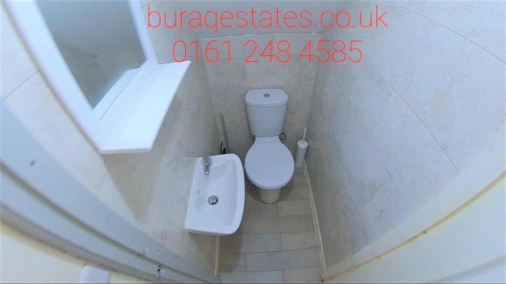 Compact, well-maintained WC with modern white s...