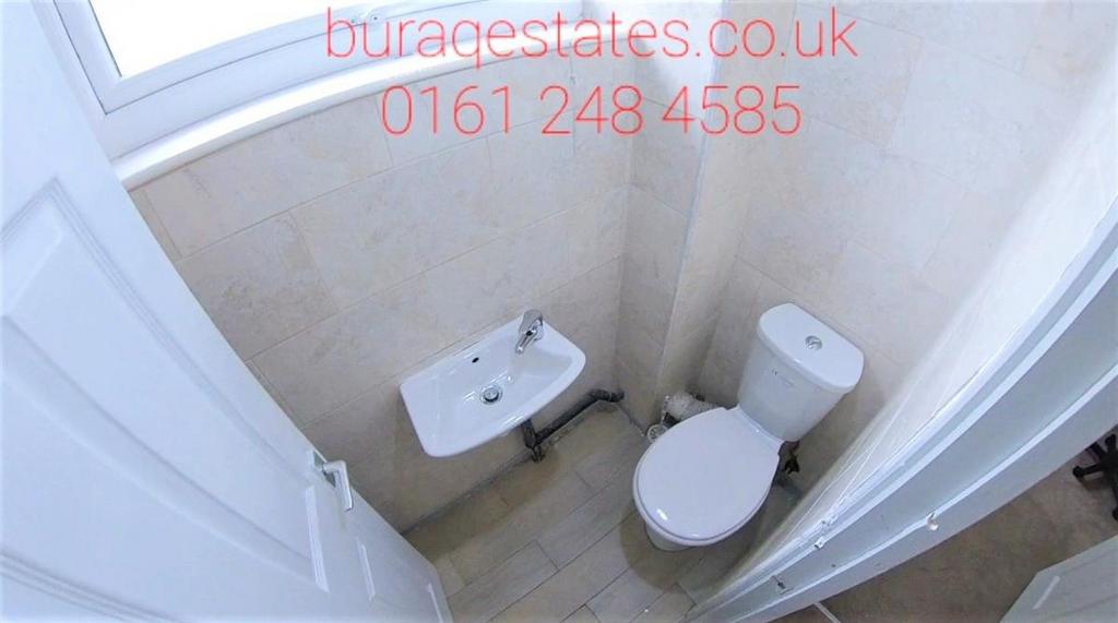 Compact, well-maintained bathroom with a modern...