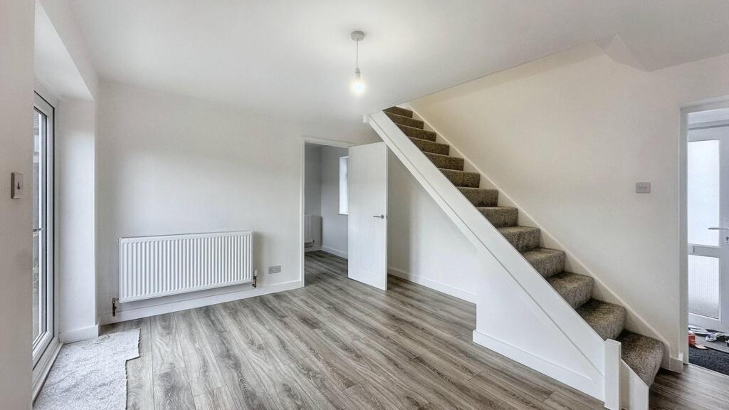 Bright, modern ground-floor living space with l...