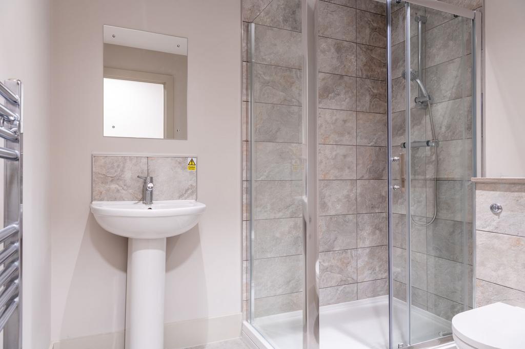 A modern, well-maintained bathroom featuring a ...