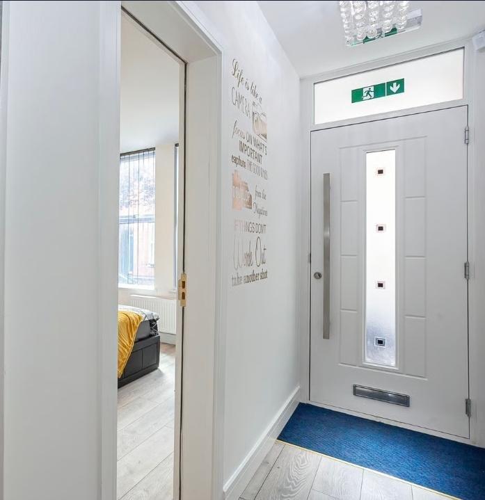 Bright, modern entrance with a contemporary whi...