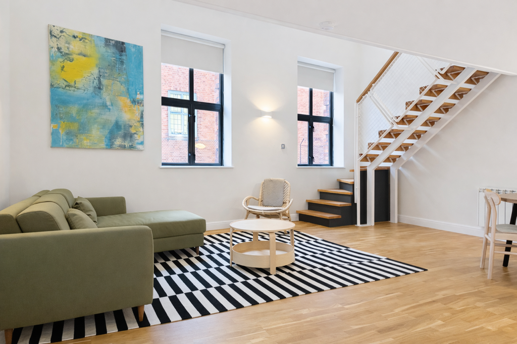 Modern living room with green sofa