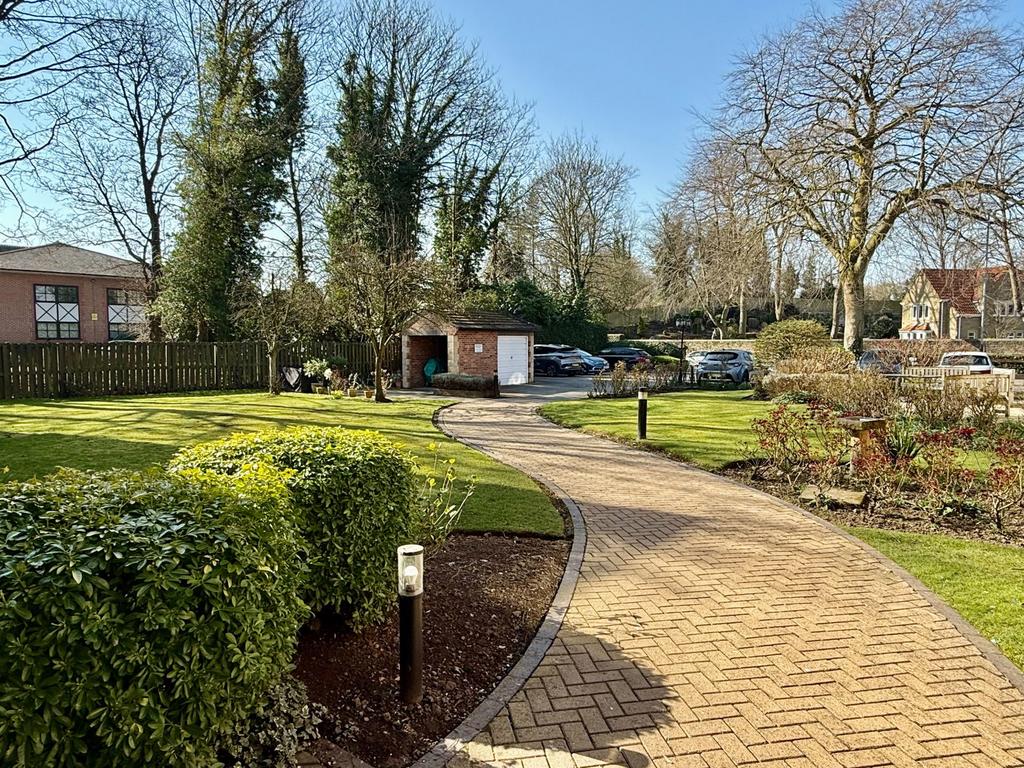 Street scene with property, garden