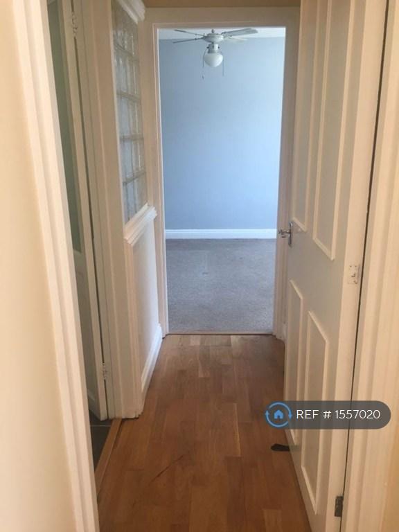 Wood Floored Corridor To The Bedroom And Bathroom