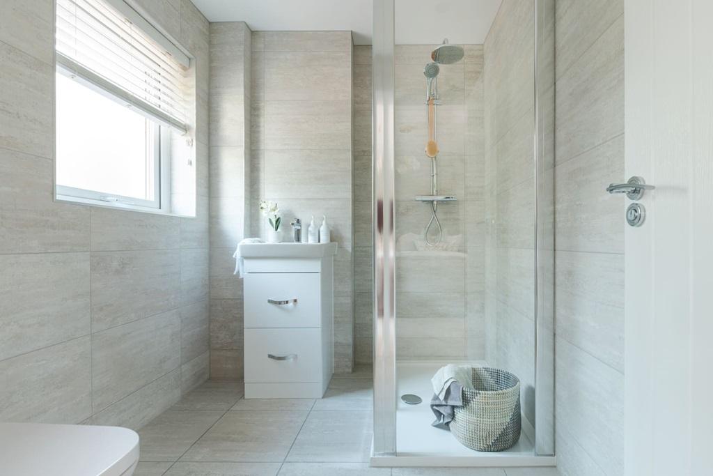 Two bedrooms boast their own en-suite shower rooms