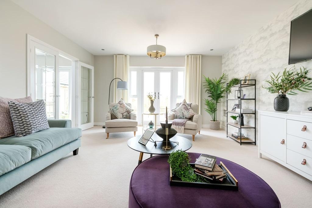 The living room features double doors out to...