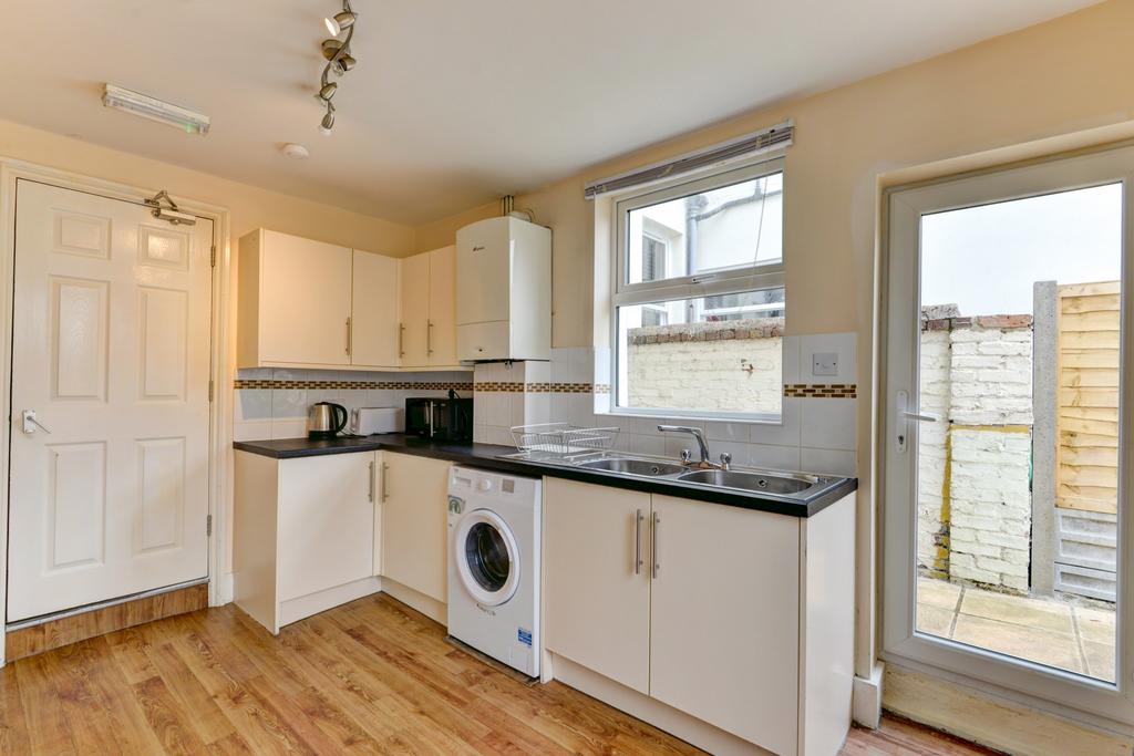 Bright and modern kitchen with ample natural li...