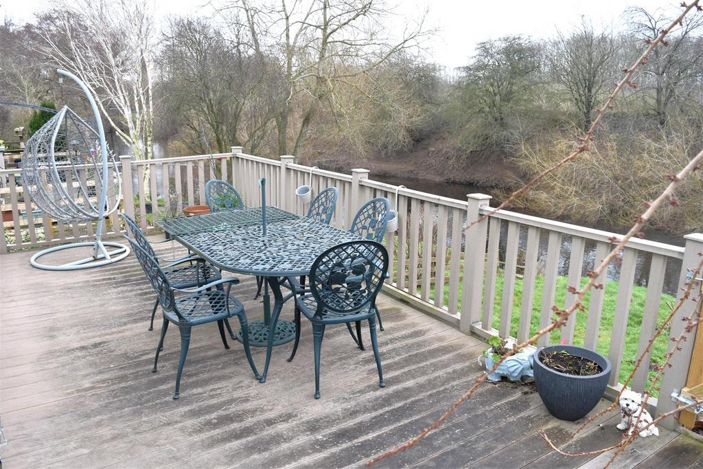 Raised decking + lawned garden