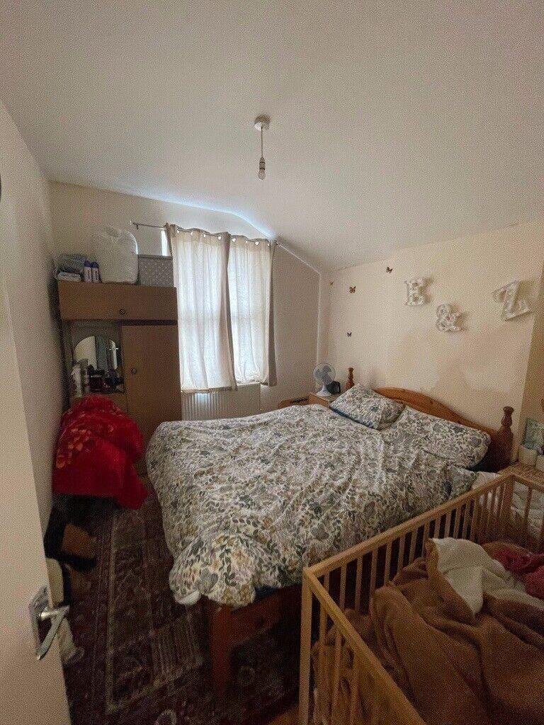 Cozy bedroom with a large double bed, soft patt...