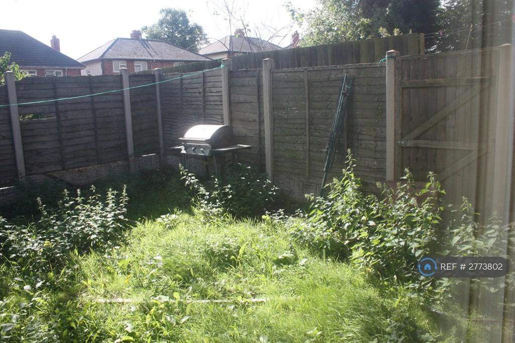 Private Garden With Artificial Turf And Patio
