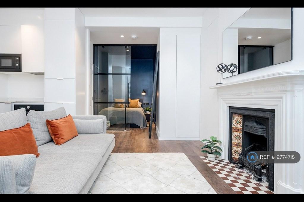 Stylish Bedroom And Cosy Living Space.