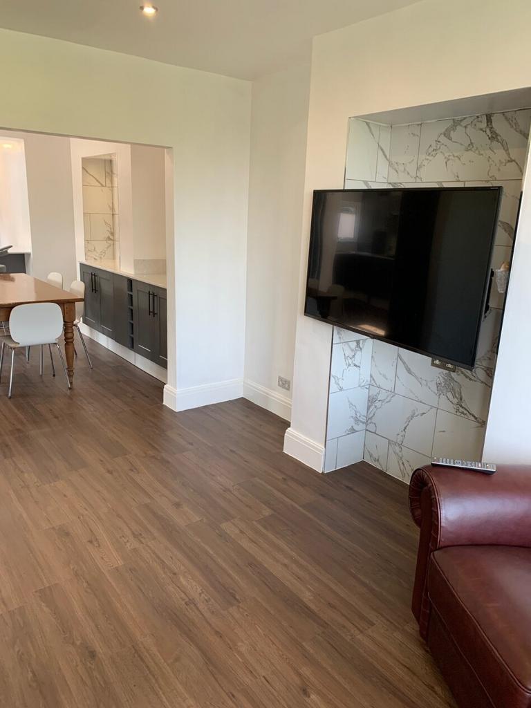 Modern and well-maintained living room featurin...