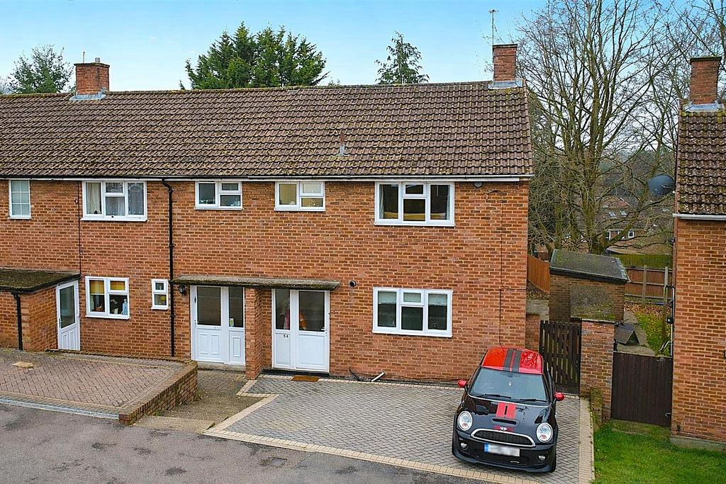 Terraced house with Mini Cooper parked.png