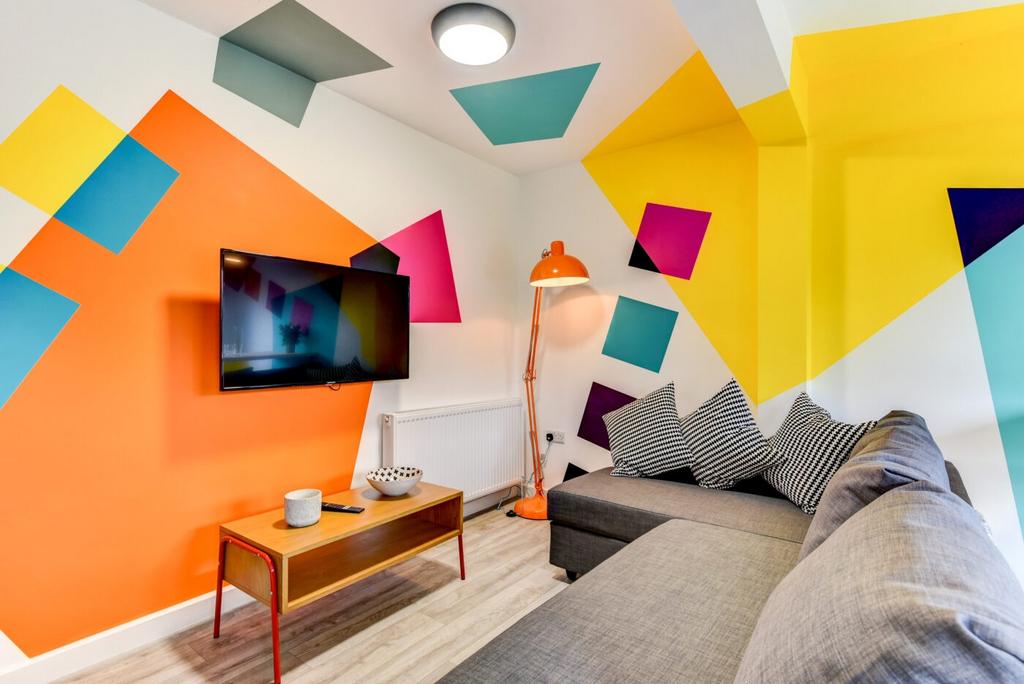 Bright, modern living room with a colourful geo...
