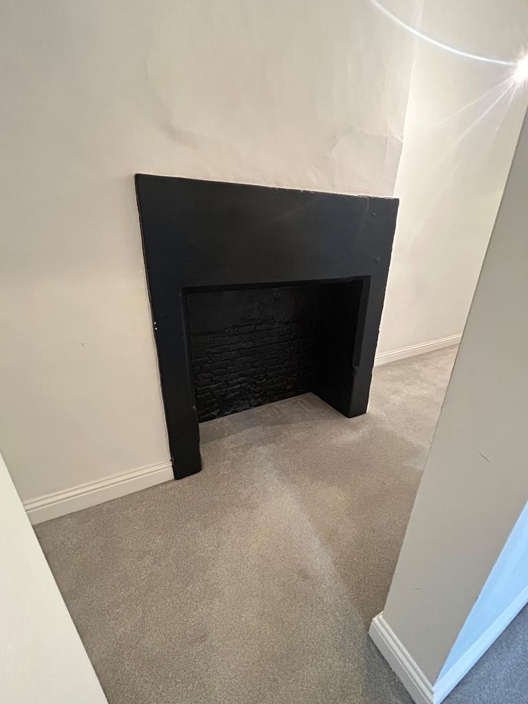 Hallway with ornimental fireplace