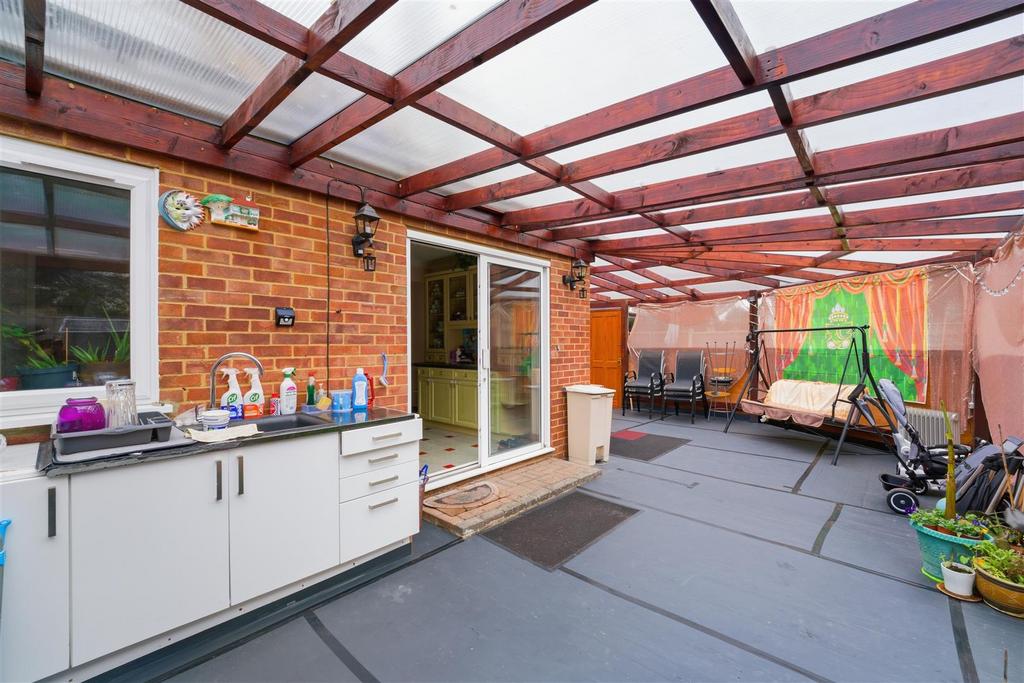 Conservatory interior, french doors leading to garden