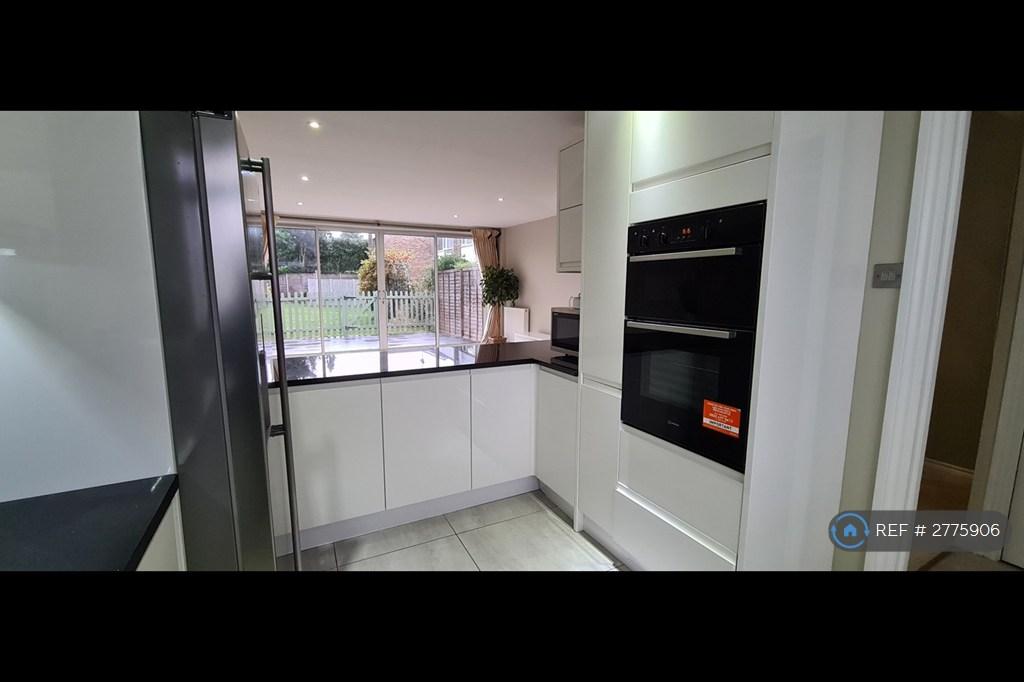 Kitchen With American Style Fridge