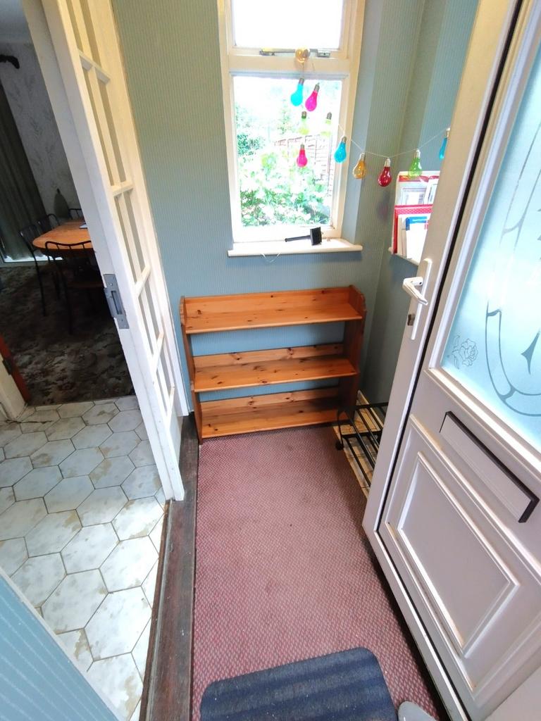 Welcoming front entrance with a window letting ...