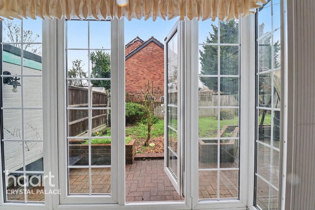 Conservatory interior, french doors leading to garden