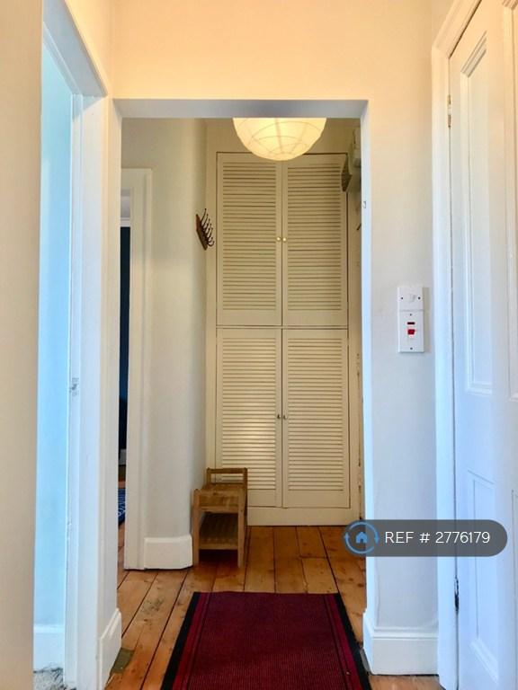Looking Along Toward Large Built In Cupboard