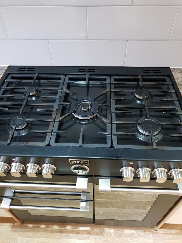Modern gas range with five burners and stainles...