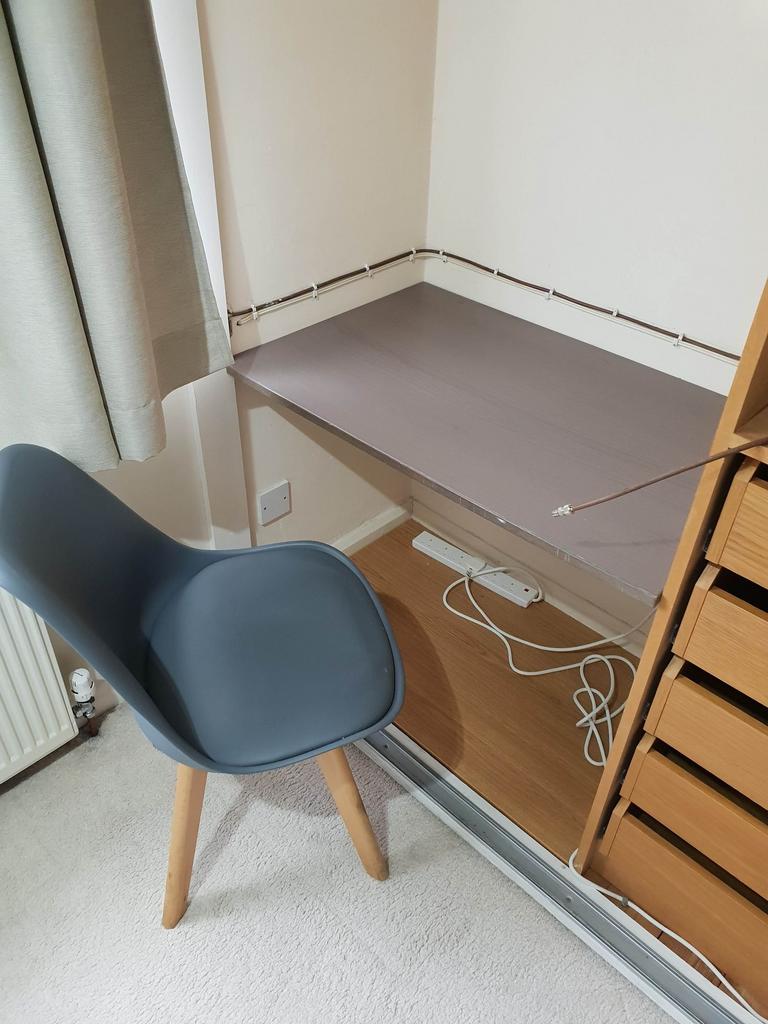 Compact bedroom corner converted into a tidy st...