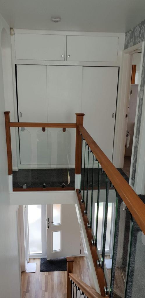 Bright, well-maintained stairwell with contempo...