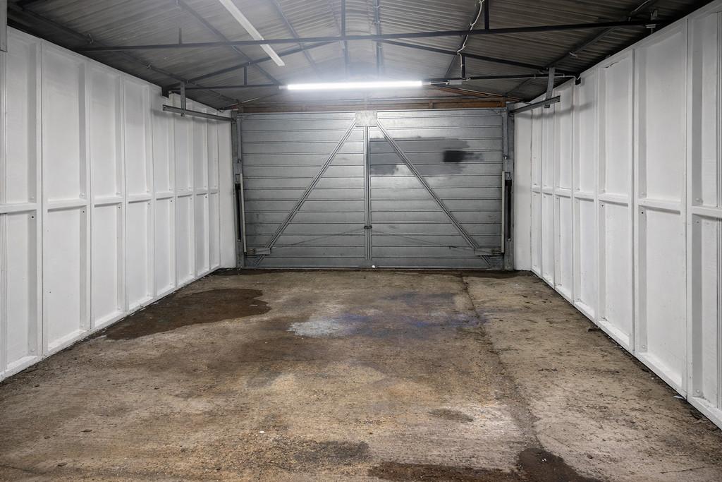 Empty garage with weathered floor