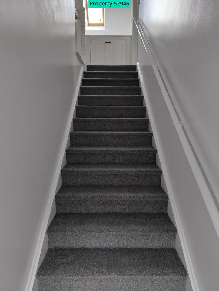 Wide entrance staircase at rear.