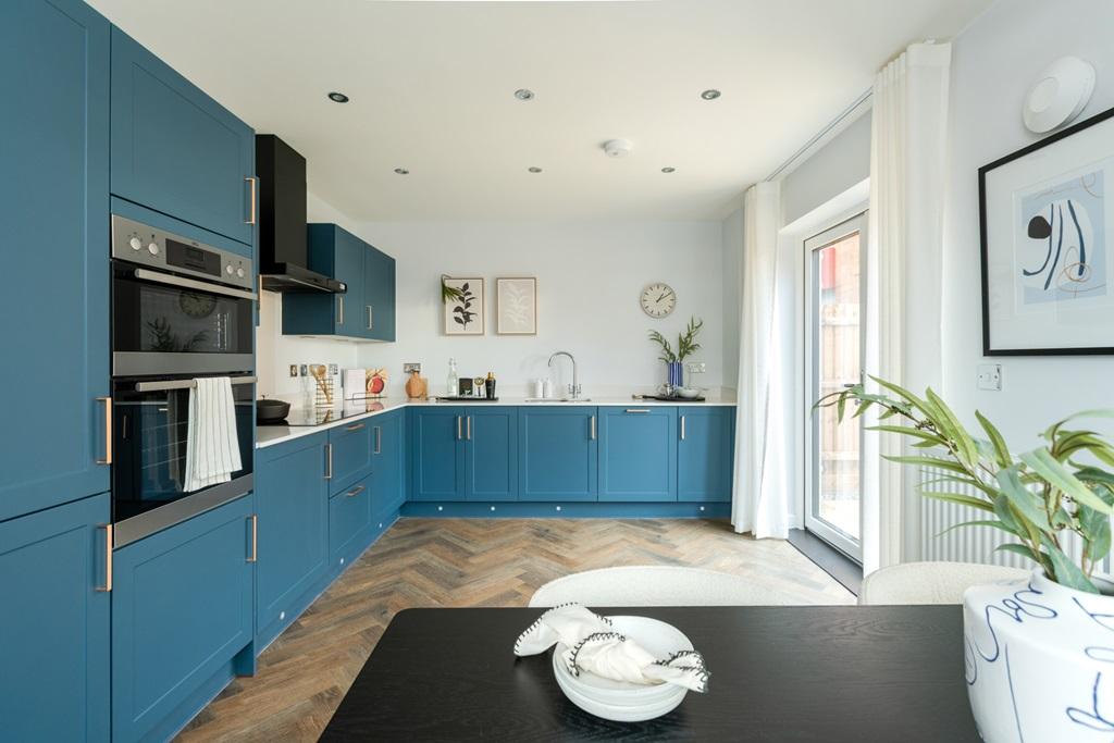 A stylish kitchen diner with double doors to...