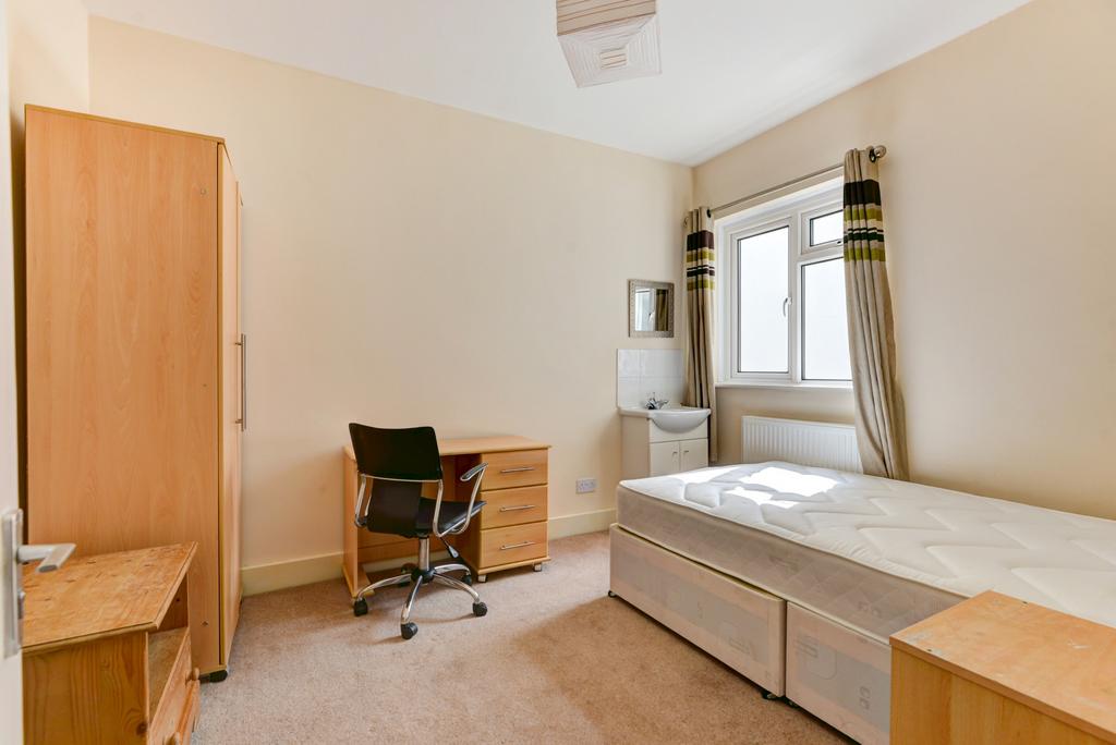 Bright, well-kept bedroom with neutral decor, a...