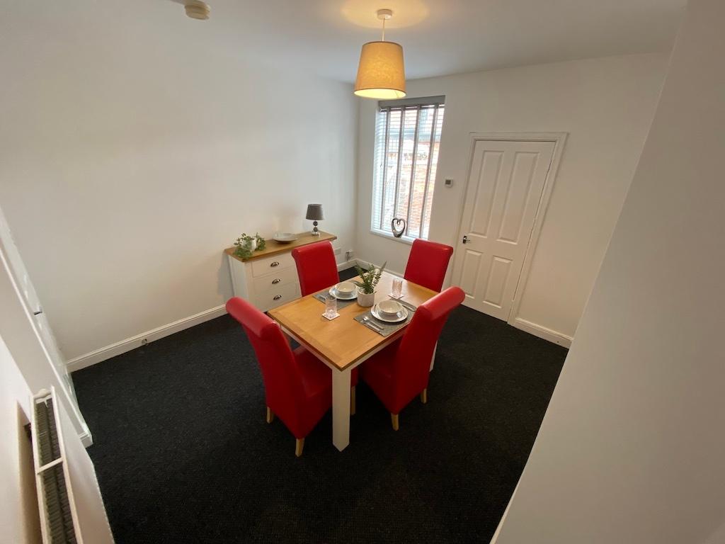Bright, freshly decorated living/dining room wi...