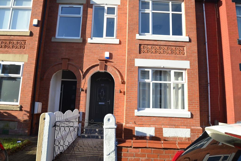 The exterior view of a classic red brick reside...