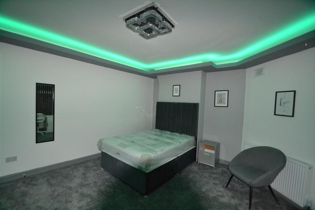 Stylish double bedroom with contemporary recess...