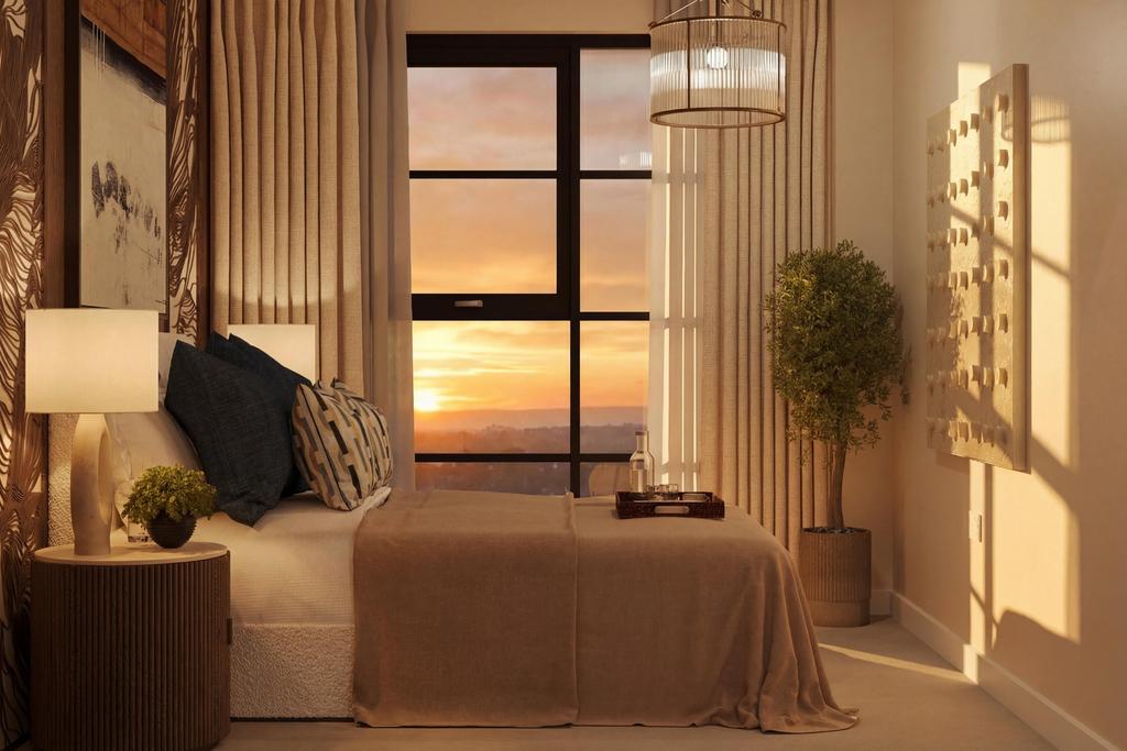 Dusk photo of bedroom with the sunset through...