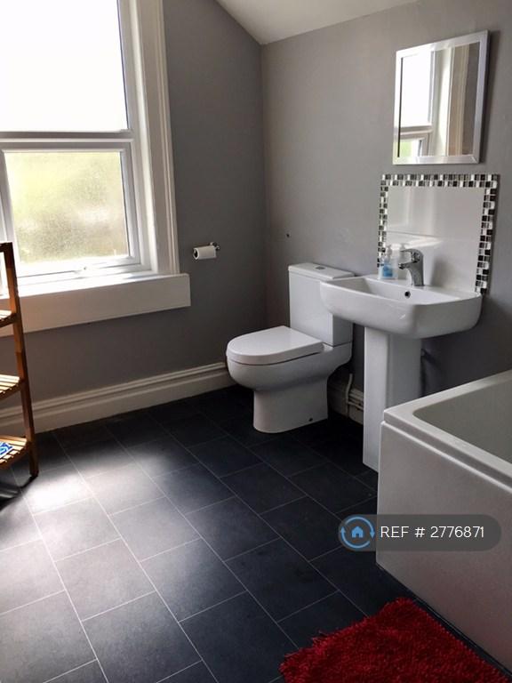 Bathroom With Over Bath Shower.