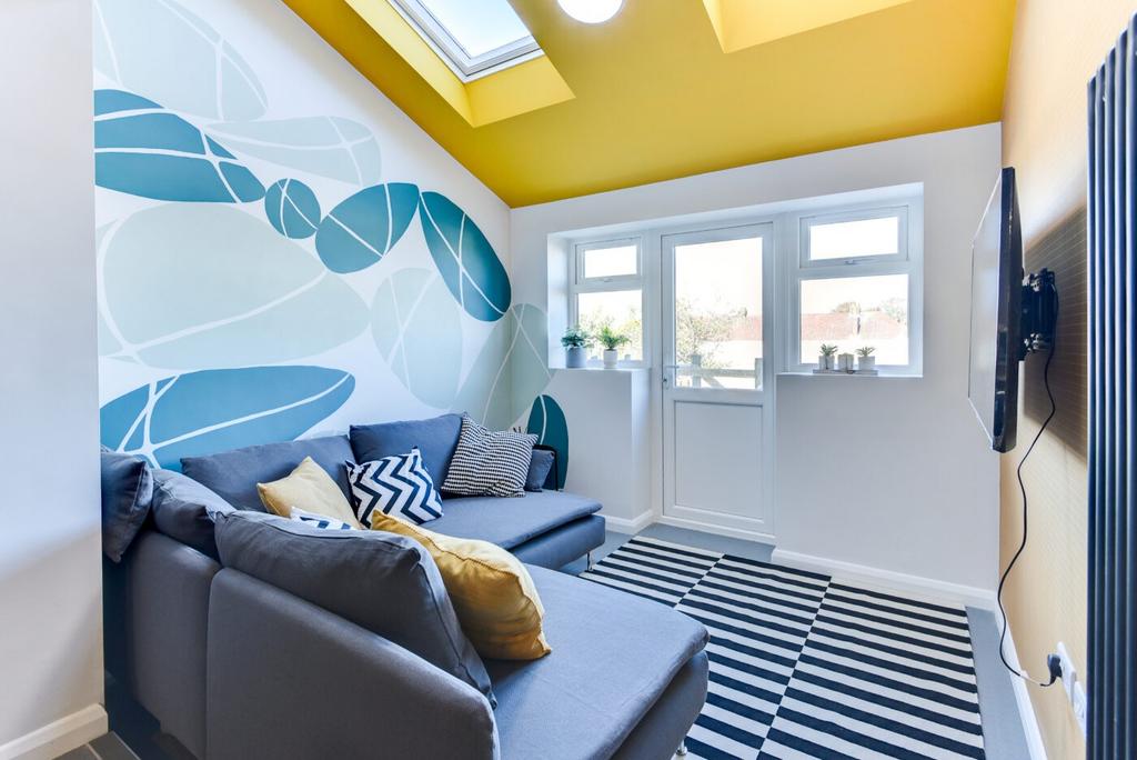 Bright, contemporary living room with a comfort...