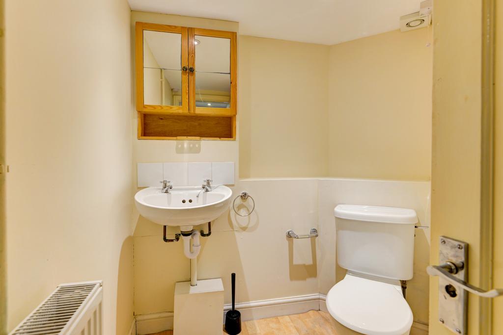 Bright, well-kept bathroom with a modern white ...
