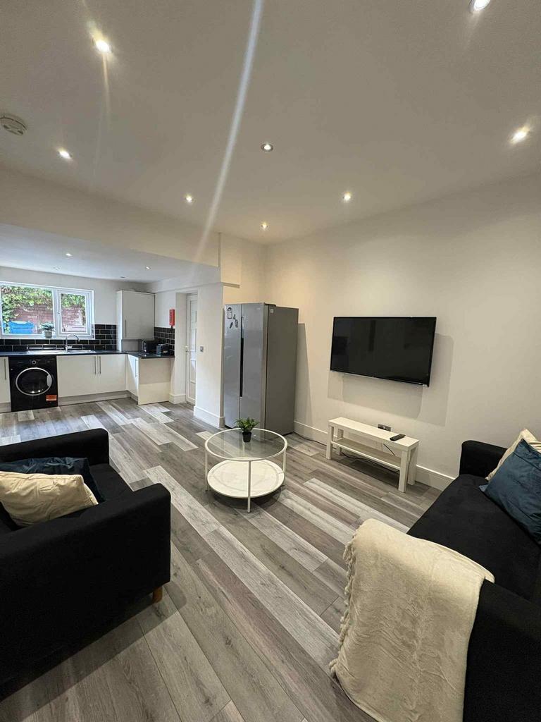 Modern and spacious living room featuring two c...