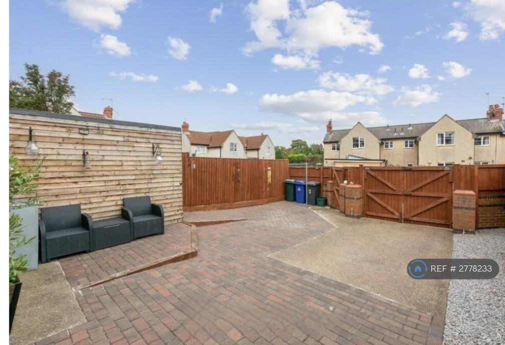 Parking Area With Gate And Shed