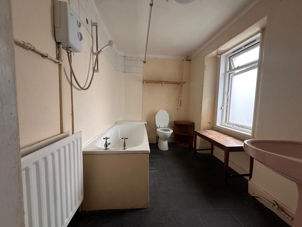 Spacious bathroom with a full-size bathtub, sep...