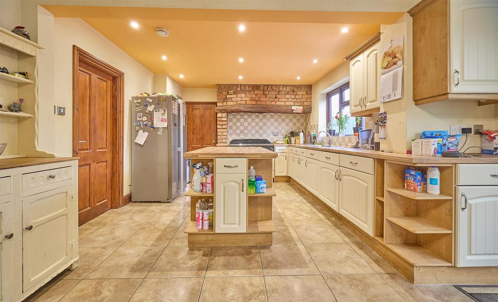 Open plan living/dining/kitchen to rear