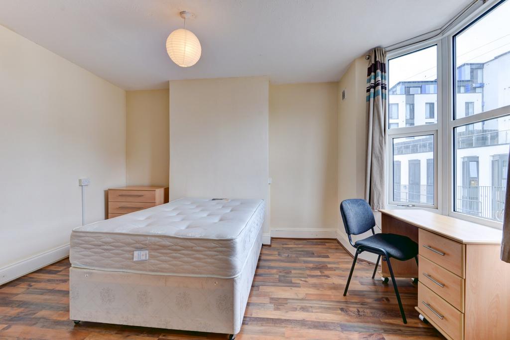 Bright, neatly presented bedroom with a comfort...