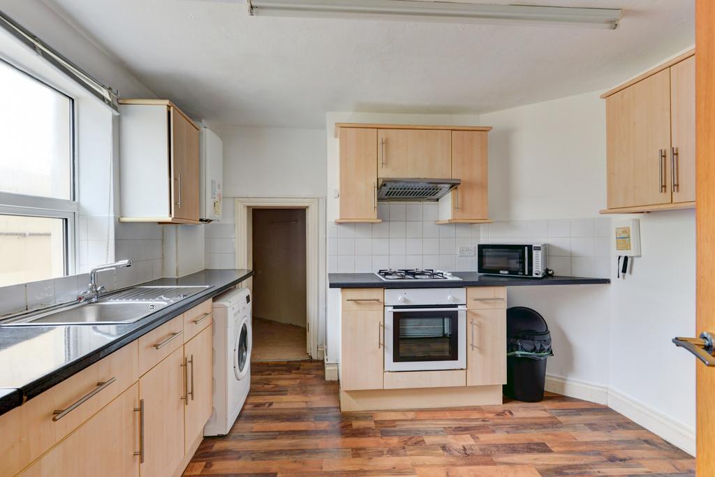 A bright and functional kitchen with ample work...
