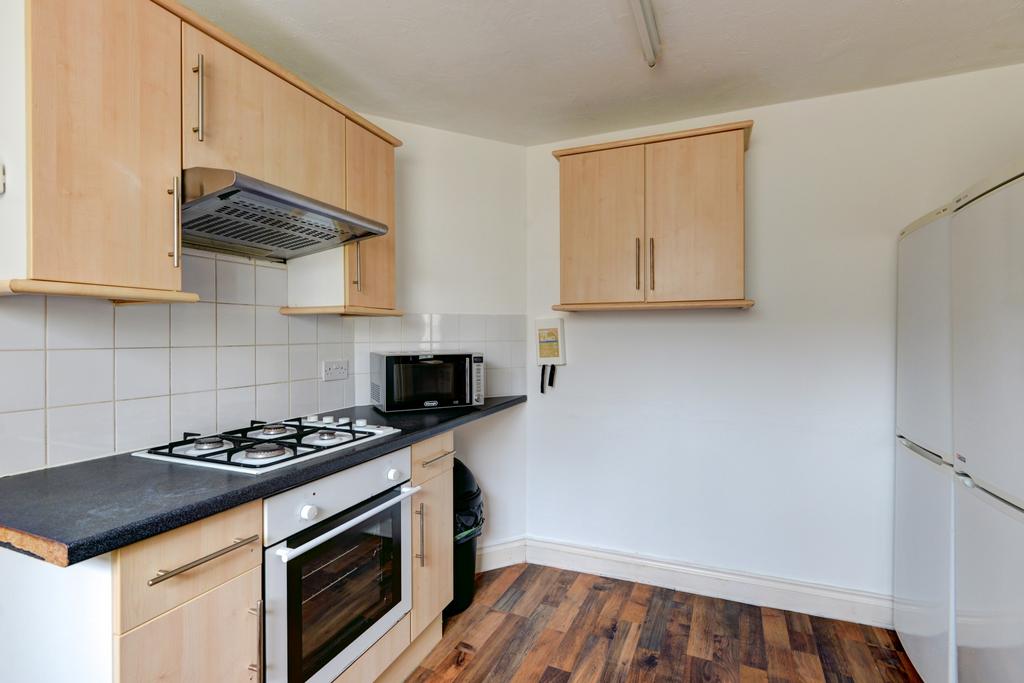 A bright and modern kitchen with a clean, tidy ...