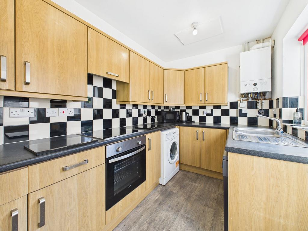 Bright modern kitchen with wood-effect cabinets...