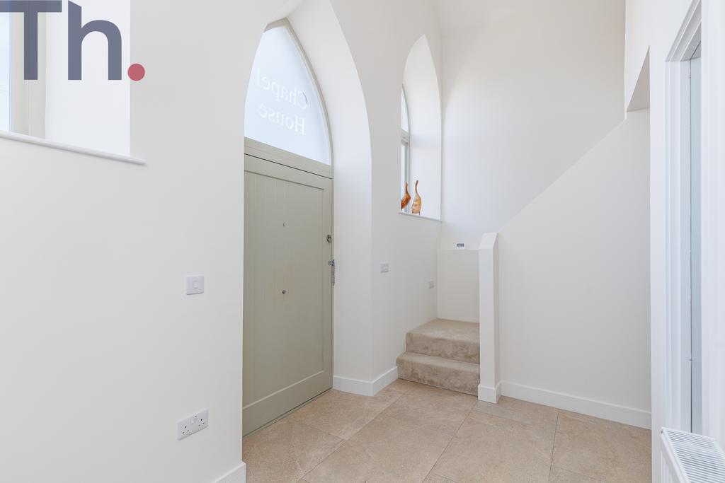 Vaulted Hallway with Stairs