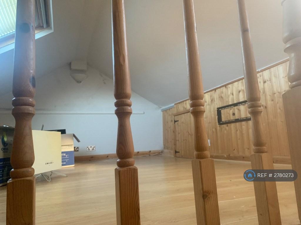 Attic Room Accessed By Spiral Staircase