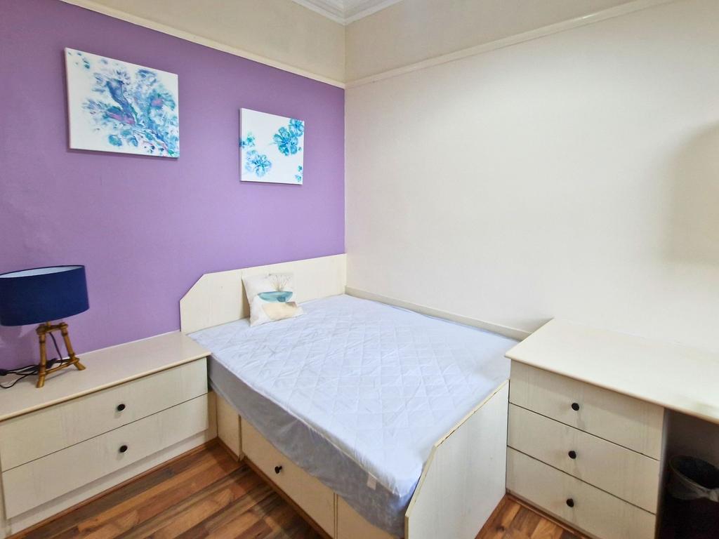 Bright, tidy bedroom with built-in storage eith...